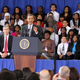 President Obama speaks at a Washington, D.C., high school as Education Secretary Arne Duncan listens. (Alex Wong/Getty Images)